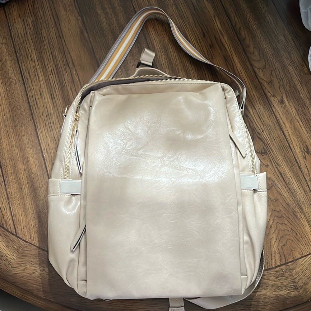 NWOT Backpack with multiple pockets and should strap, will hold 15” computer.